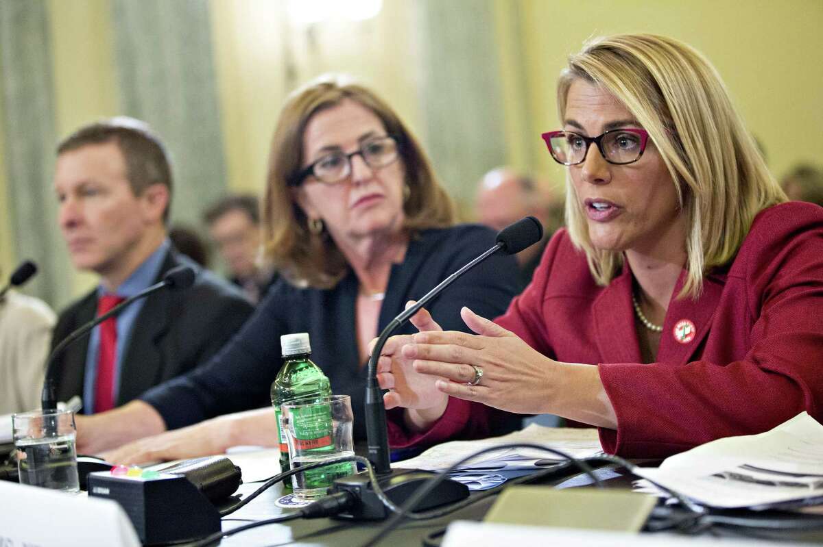 Sara Nelson (right), international president of the Association of Flight Attendants, speaks as Sharon Pinkerton, senior vice president of legislative and regulatory policy with Airlines for America, and Scott Kirby, president of United Continental Holdings Inc., listen during a Senate subcommittee hearing Thursday. Nelson says United employees have come under siege since the Dao incident.