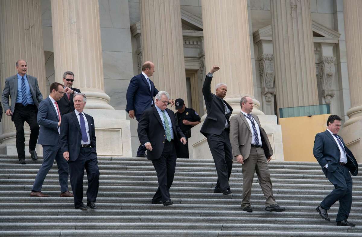 Lawmakers walk out of the US Capitol in Washington, DC, on May 4, 2017 after the House of Representatives narrowly passed a Republican effort to repeal and replace Obamacare, delivering a welcome victory to President Donald Trump after early legislative stumbles. Following weeks of in-party feuding and mounting pressure from the White House, lawmakers voted 217 to 213 to pass a bill dismantling much of Barack Obama's Affordable Care Act and allowing US states to opt out of many of the law's key health benefit guarantees.