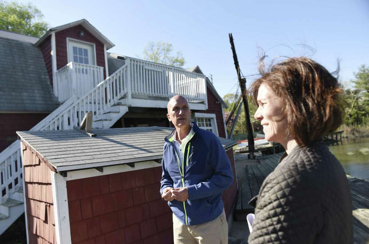Chris and Rachel Franco show their Riverside Avenue home in the Riverside section of Greenwich, Conn. Wednesday, May 3, 2017. The house, which has plans approved to be rebuilt and restored soon, used to be an oyster house and more recently a prosthetics manufacturer.