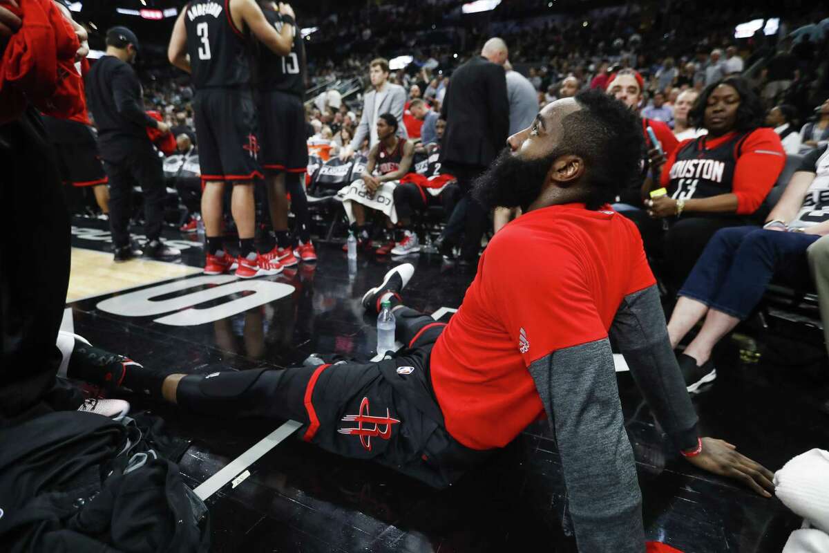 Houston Rockets guard James Harden sits on the floor during the second half of Game 2 against the Spurs at the AT&T Center on May 3, 2017, in San Antonio.