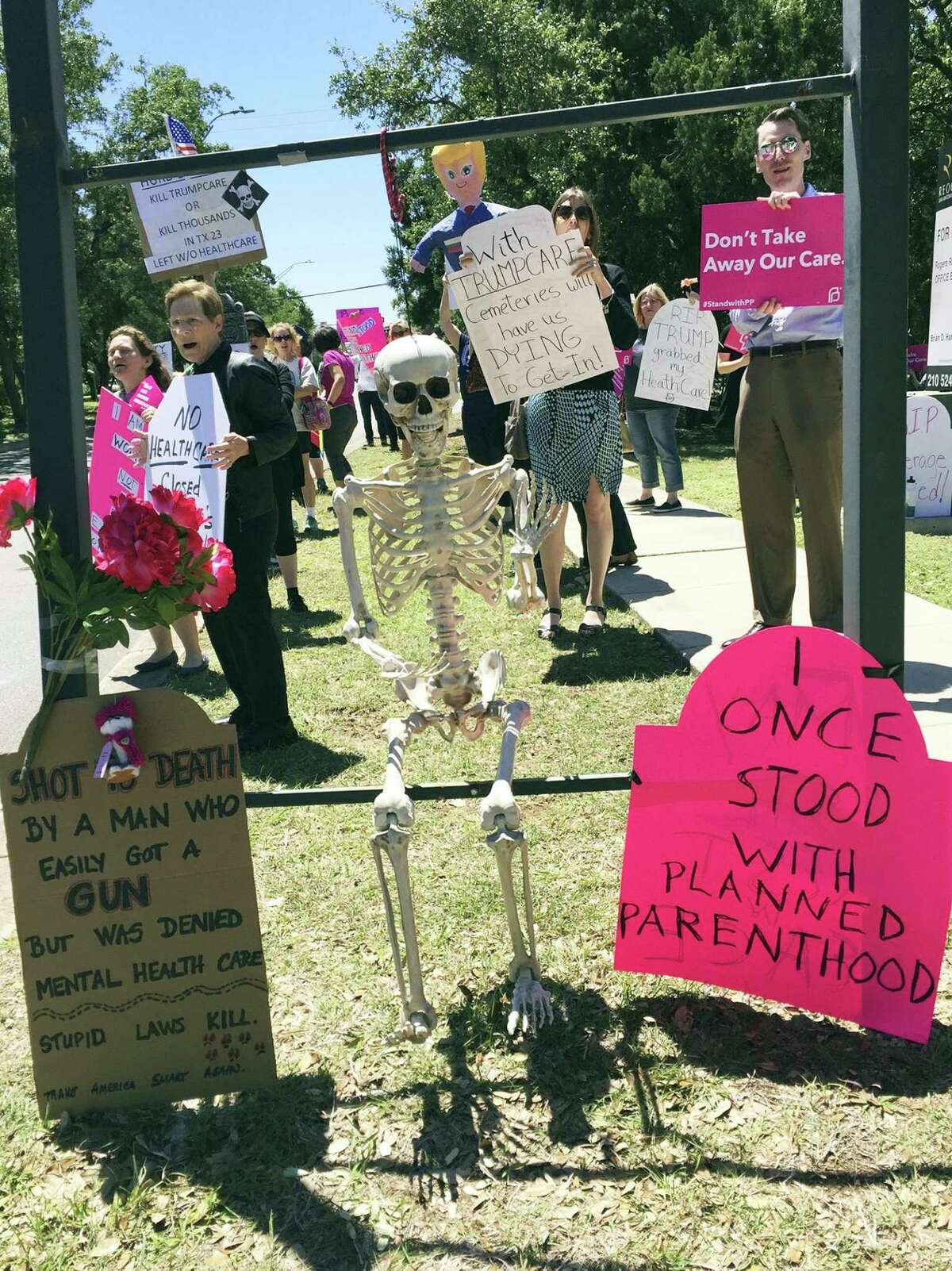 Protesters gather at U.S. Rep. Will Hurd’s San Antonio office for a "die-in" in the day that the Repbulican-led House of Representatives passed a new health care bill that could overturn the Affordable Care Act known as Obamacare.