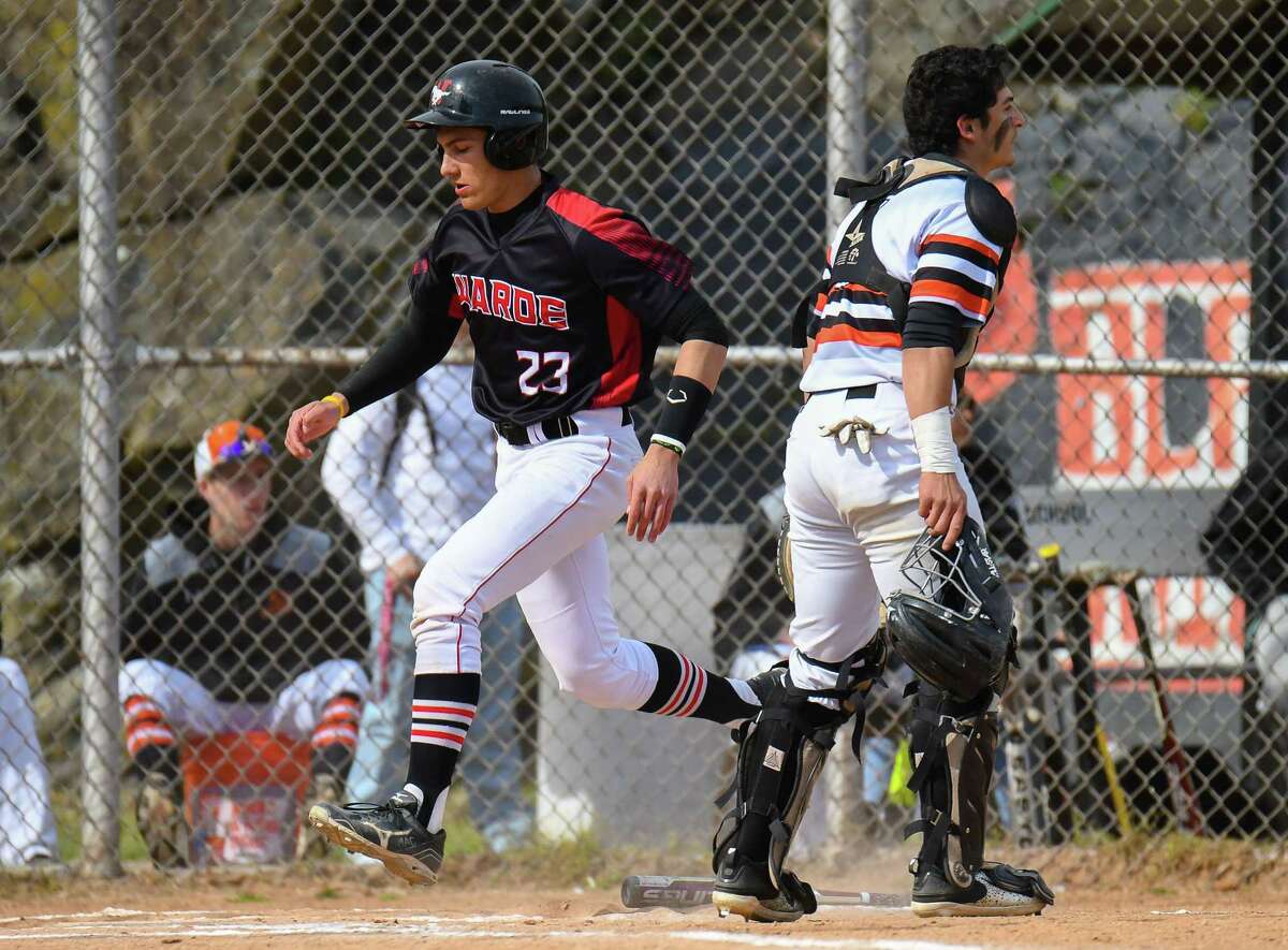 Giacomo Brancato (23) of the Fairfield Warde Mustangs crosses home plate during a game against the Stamford Black Knights at Stamford High School on May 4, 2017 in Stamford, Connecticut.