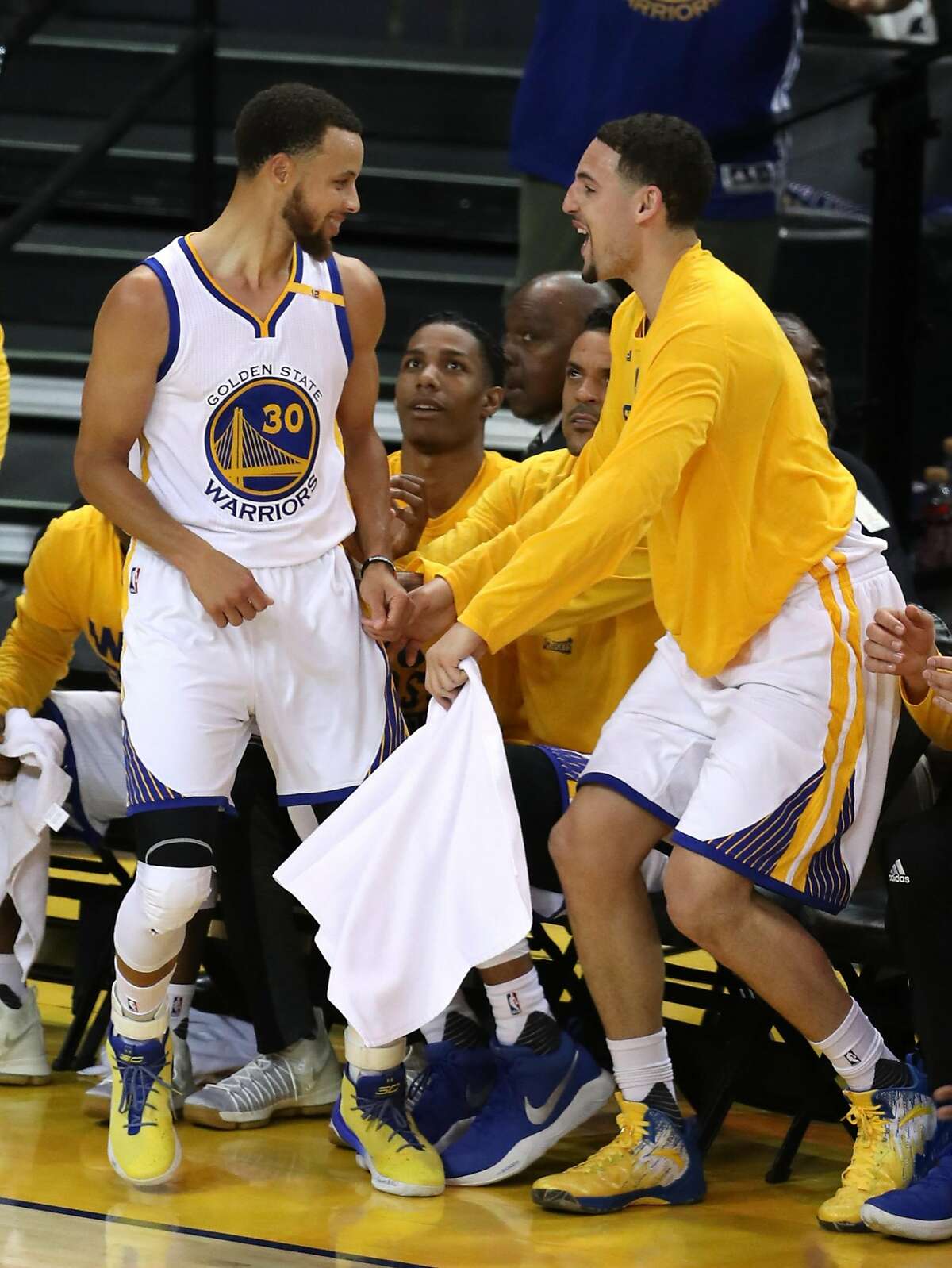 Golden State Warriors' Stephen Curry celebrates a 4th quarter 3-pointer with Klay Thompson against Utah Jazz during Game 2 of NBA Western Conference Semifinals at Oracle Arena in Oakland, Calif., on Thursday, May 4, 2017.