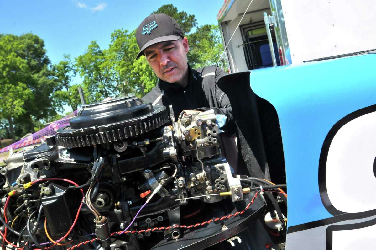 Skelton Racing's R.J. West installs a starter on his SST-45, Formula Light powerboat after arriving in the pit area Thursday ahead of this weekend's Thunder on the Neches races. (Mike Tobias/The Enterprise)