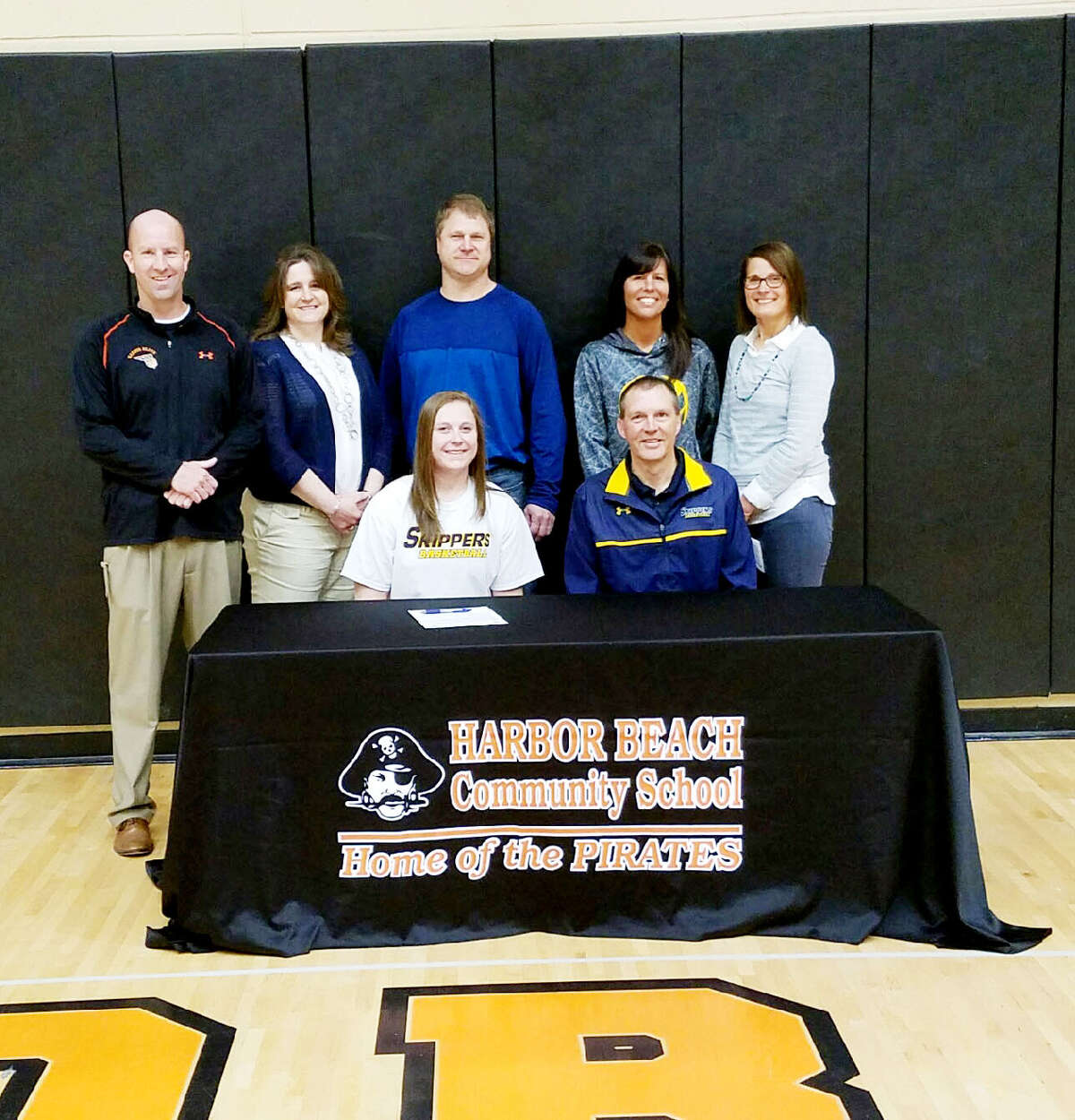   Harbor Beach’s McKenna Wolschleger signed her National Letter of Intent to play basketball at St. Clair County Community College next year. In the front row is McKenna Wolschleger and SC4 women’s basketball coach Chris Huss (back row from left) is Harbor Beach coach Jim Tamlyn, Connie Wolschleger, Darrin Wolschleger Tanya Huss and Harbor Beach junior varsity girls basketball Ellynne Volmering.