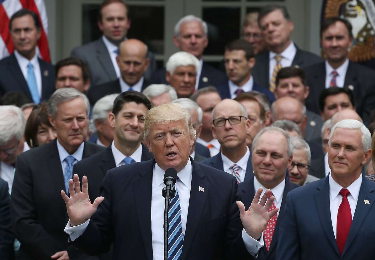 WASHINGTON, DC - MAY 04: U.S. President Donald Trump (C) speaks while flanked by House Republicans after they passed legislation aimed at repealing and replacing ObamaCare, during an event in the Rose Garden at the White House, on May 4, 2017 in Washington, DC. The House bill would still need to pass the Senate before being signed into law. (Photo by Mark Wilson/Getty Images)