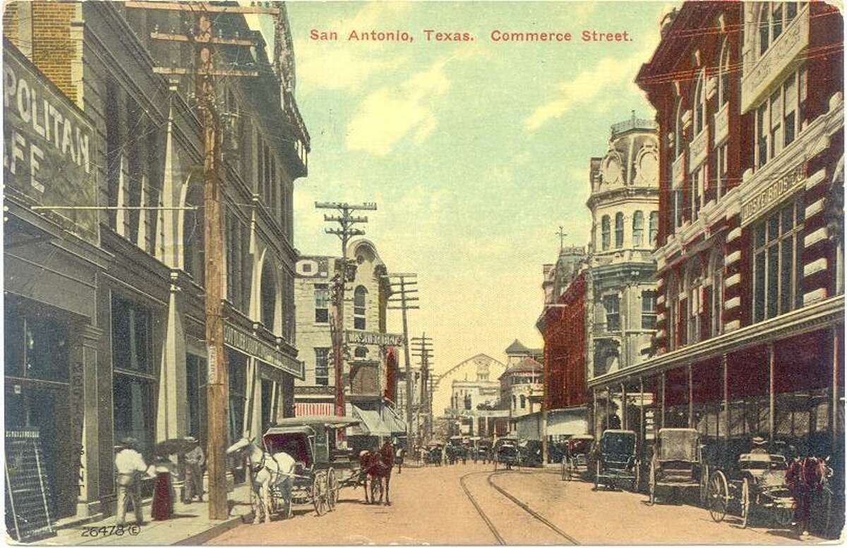 A postcard shows buggies in use in 1890 along Commerce Street in downtown San Antonio.