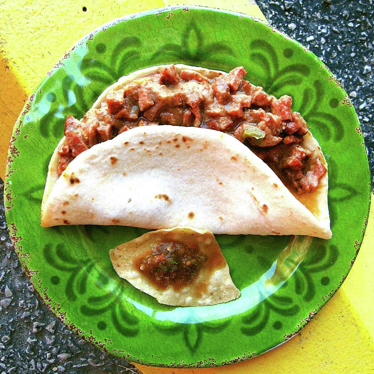 Country sausage guisada with beans on a handmade flour tortilla from the Curve Restaurant.