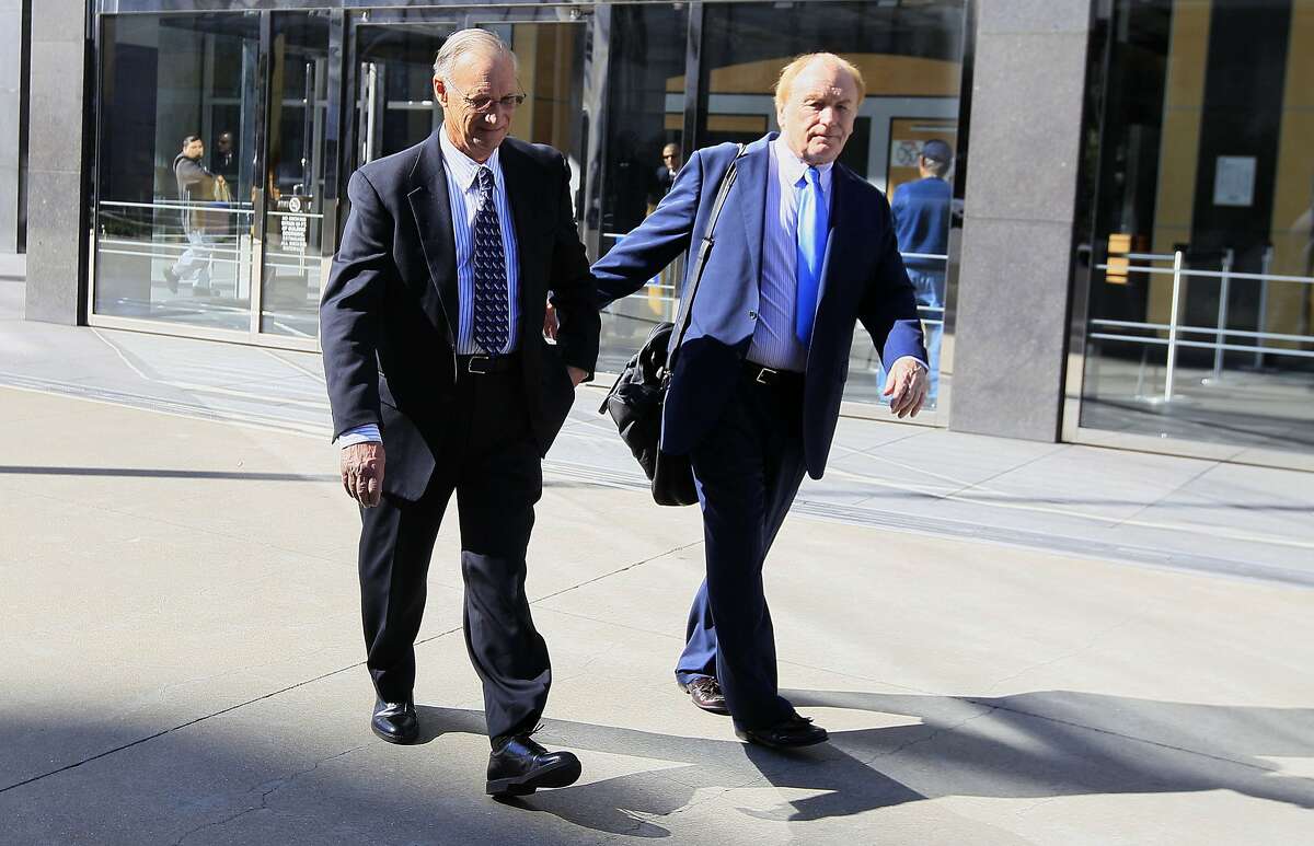 Robert Maegerle, left, walks out of a federal courthouse with attorney Jerome Froelich Jr. in San Francisco, Thursday, March 8, 2012. Maegerle, a retired DuPont engineered accused of working with Walter Liew to illegally sell DuPont�s techonology to a company controlled by the Chinese government, pleaded not guilty to economic espionage charges. (AP Photo/Jeff Chiu)