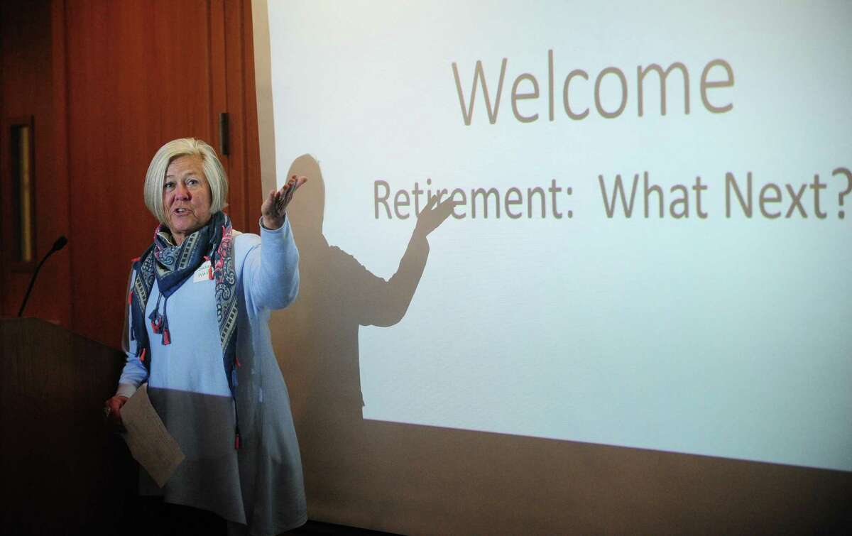 Former teacher Susan Wallerstein emcees Life Beyond the Classroom, a program dedicated to sharing the stories of teachers who have found success in their post-retirement lives helping those who may be nearing retirement on Thursday at Norwalk Community College.