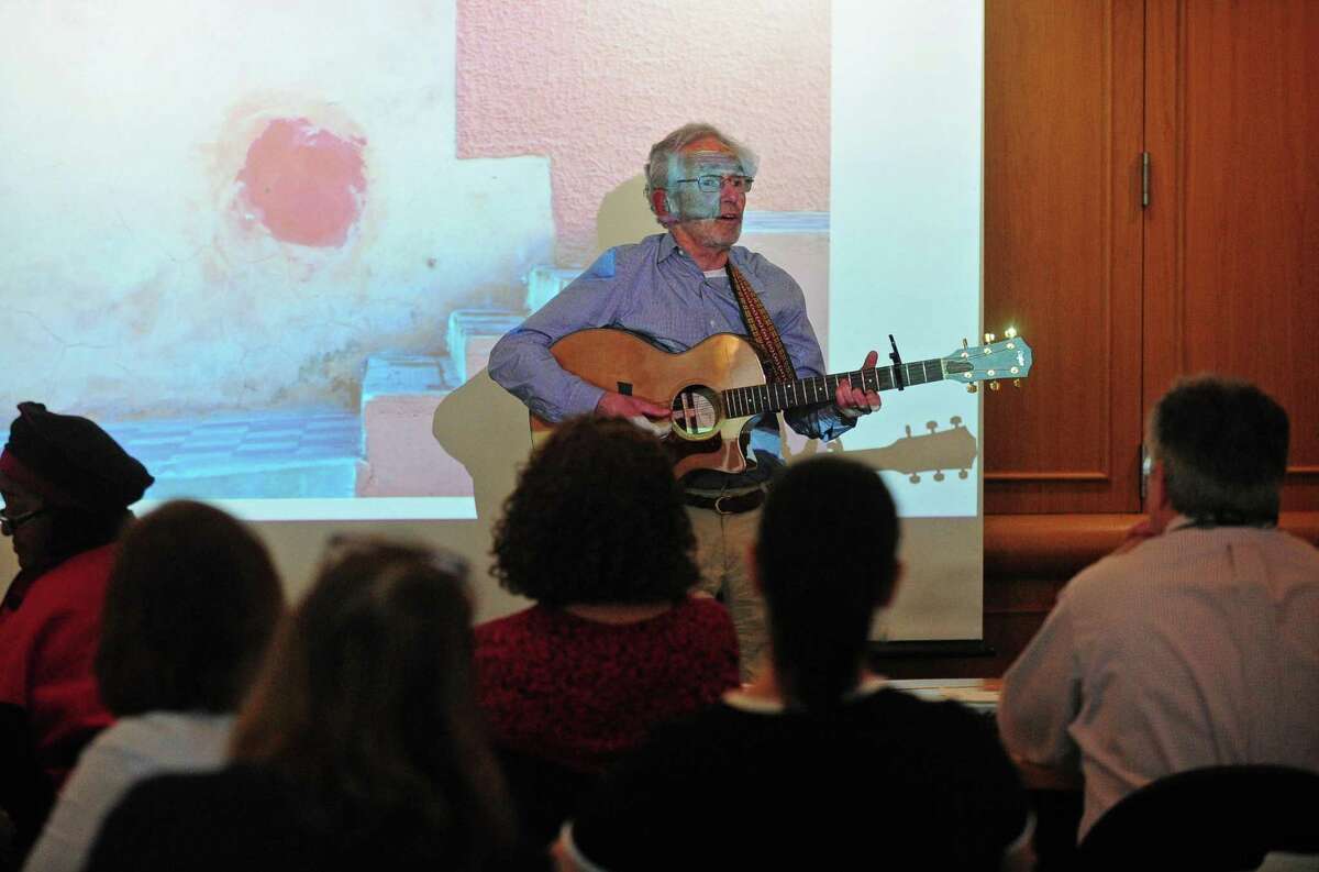 Former teacher Tom Kretch talks about his love of music and photography during Life Beyond the Classroom, a program dedicated to sharing the stories of teachers who have found success in their post-retirement lives helping those who may be nearing retirement on Thursday at Norwalk Community College.