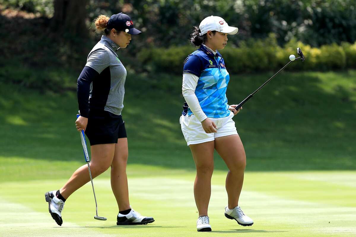 MEXICO CITY, MEXICO - MAY 05: (L-R) Sisters Ariya Jutanugarn and Moriya Jutanugarn of Thailand walk on the twelth green during the second round of the Citibanamex Lorena Ochoa Match Play Presented by Aeromexico and Delta at Club De Golf Mexico on May 5, 2017 in Mexico City, Mexico. (Photo by Sean M. Haffey/Getty Images)