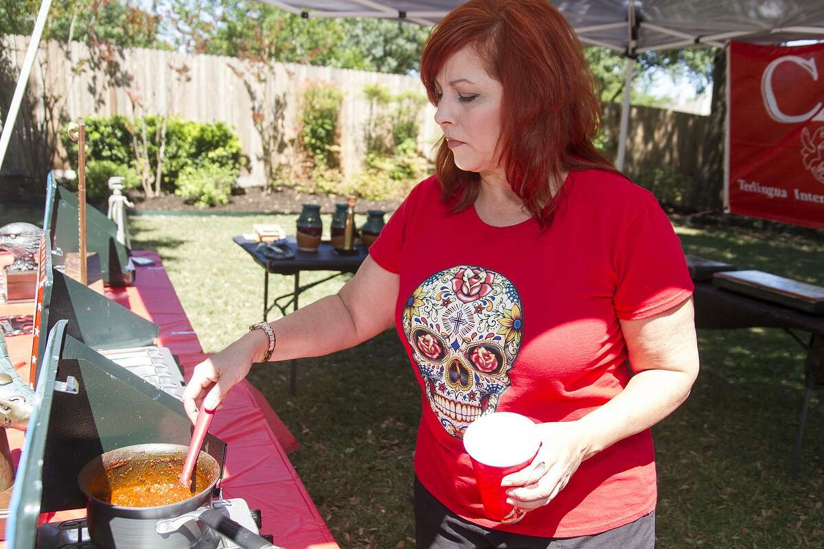 Dianne Edmonson Lewis serves chili at her sister Terry Edmonson Foresman's home.