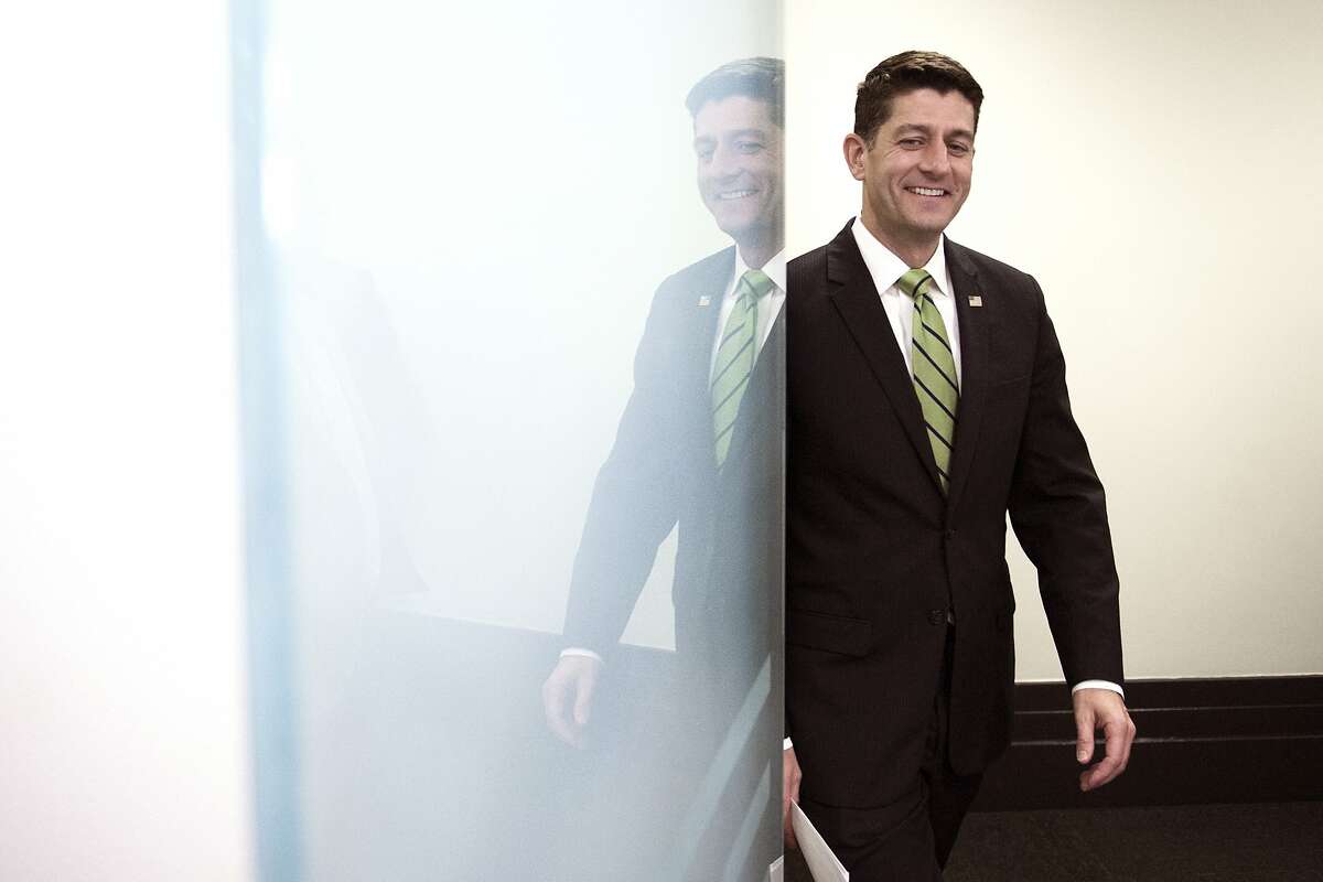 House Speaker Paul Ryan of Wis. is reflected in a glass door as he arrives to speak with reporters following the Republican Caucus meeting on Capitol Hill in Washington, Tuesday, May 2, 2017. (AP Photo/Cliff Owen)