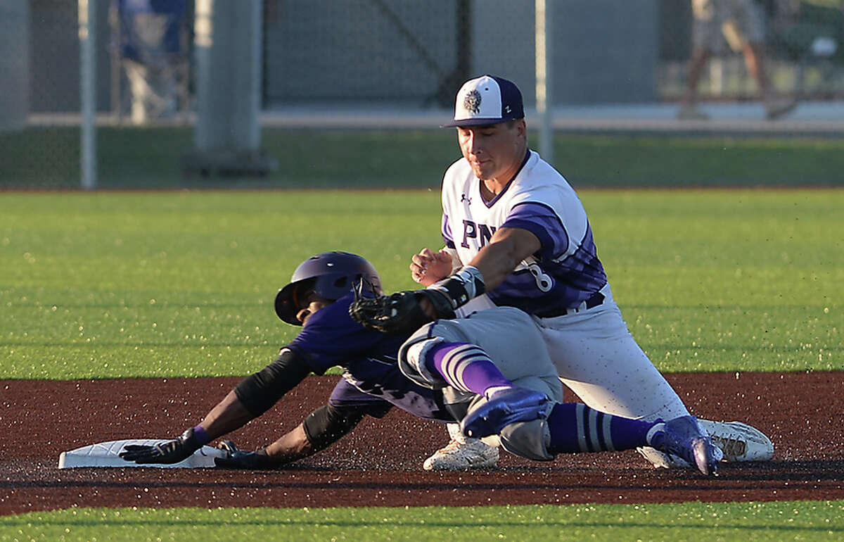 Port Neches - Groves' Logan LeJeune tags Humbles' Tyrese Clayborne for the out at second base during their first of three play-off match-up with Humble at home Friday. Photo taken Friday, May 5, 2017 Kim Brent/The Enterprise