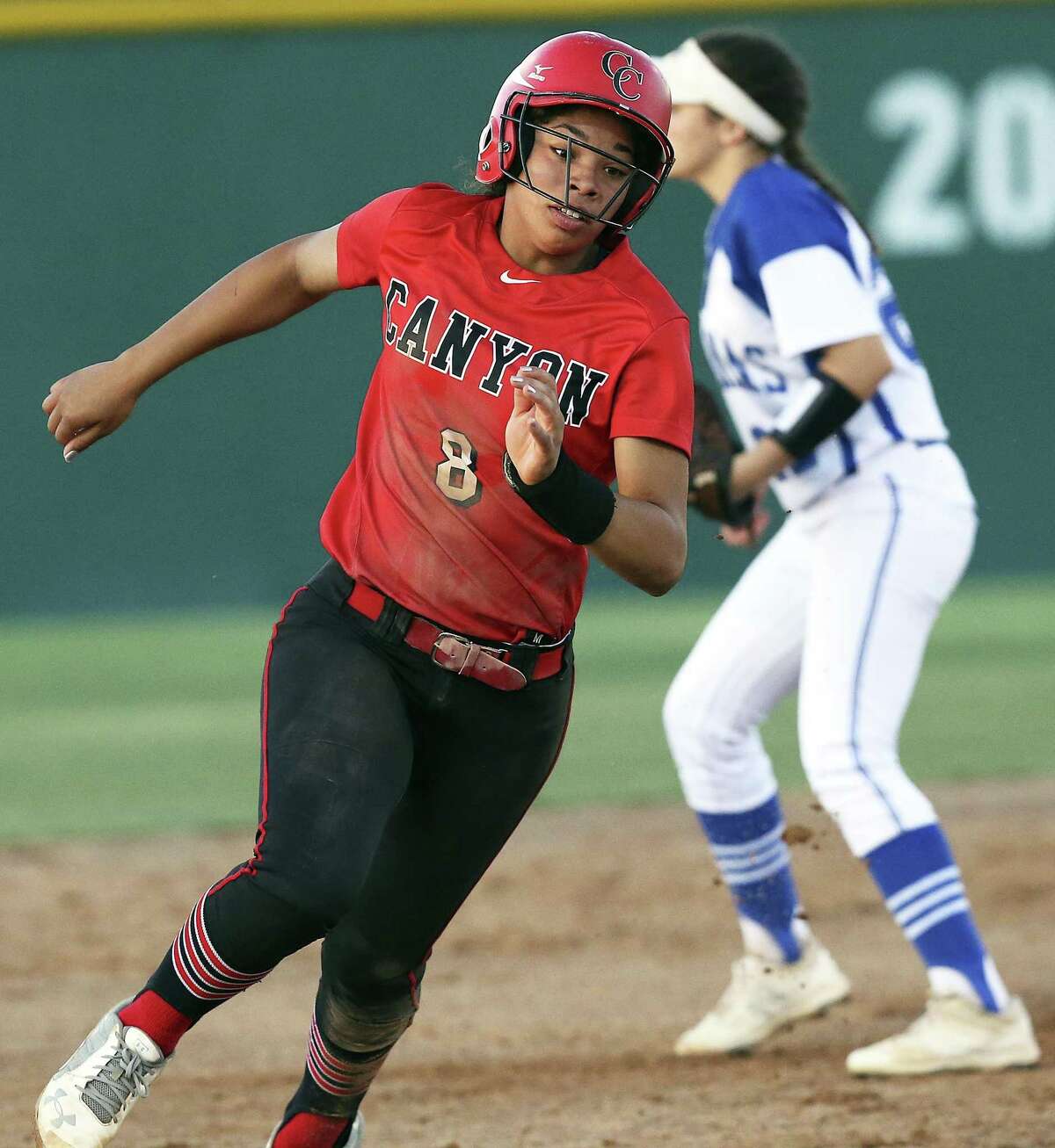 Aliyah Pritchett rounds second base in the early innings as Canyon plays MacArthur in clas 6A second round softball playoffs on May 5, 2017.