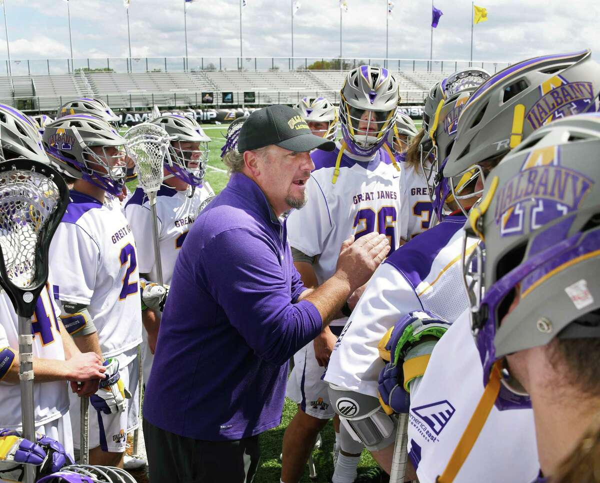 UAlbany head coach Scott Marr, center, congratulates players after their 20-8 win over Binghamton for the America East championship Saturday May 6, 2017 in Albany, NY. (John Carl D'Annibale / Times Union)