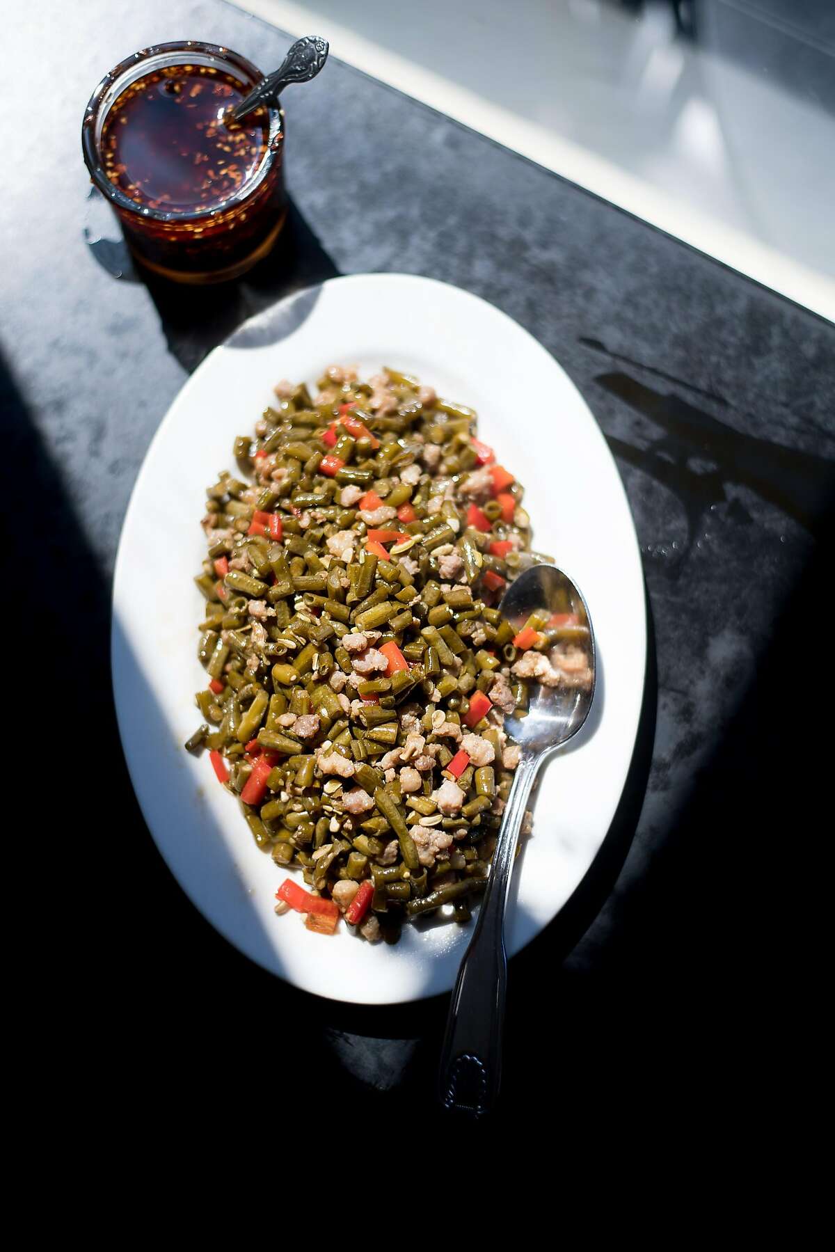 Pickled Long Beans with Ground Pork & Chiles rest on a table at Mama Ji's on Thursday, May 4, 2017, in San Francisco. Co-owner Lily Wolpa based the dumplings on her mom's recipe.