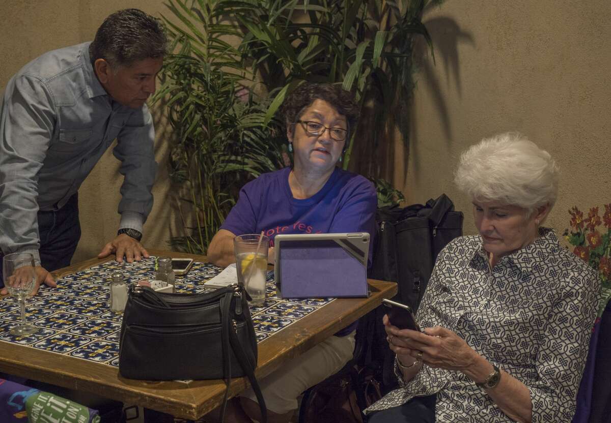 Mayor Jerry Morales looks at the final numbers as Charlene Romero McBride pulls up election results as councilwoman Sharla Hotchkiss sees the results of the 4B Tax vote 5/06/17. Tim Fischer/Reporter-Telegram