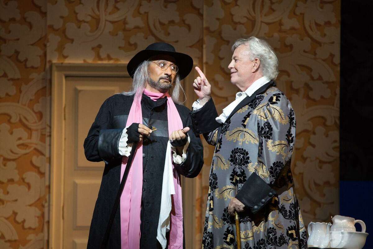 Baritone Luis Ledesma, left, portraying Figaro, sings with baritone Jake Gardner, Bartolo, in a scene from Opera San Antonio's "The Barber of Seville."