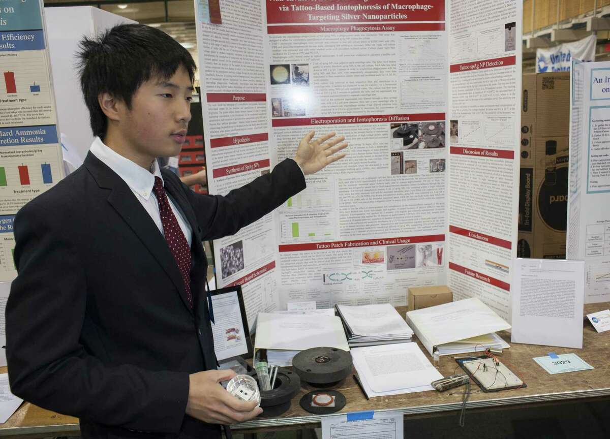 William Yin from Greenwich High School showing his project at the Connecticut Science & Engineering Fair held at Quinnipiac University, Hamden, CT Thursday, March 17, 2016.