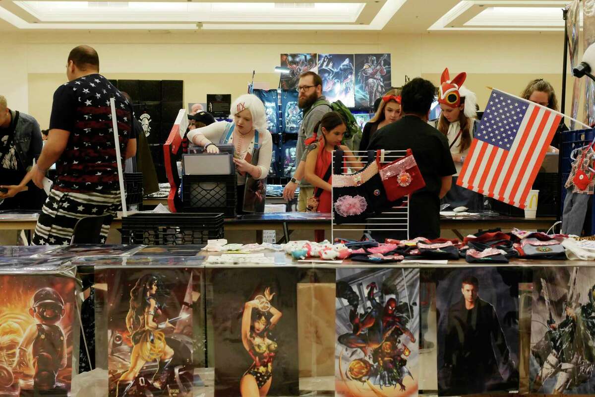 Visitors look over the different items for sale at vendor's booths at the Saratoga Comic Con at the Saratoga City Center on Sunday, May 7, 2017, in Saratoga Springs, N.Y. The event was held Saturday and Sunday. (Paul Buckowski / Times Union)