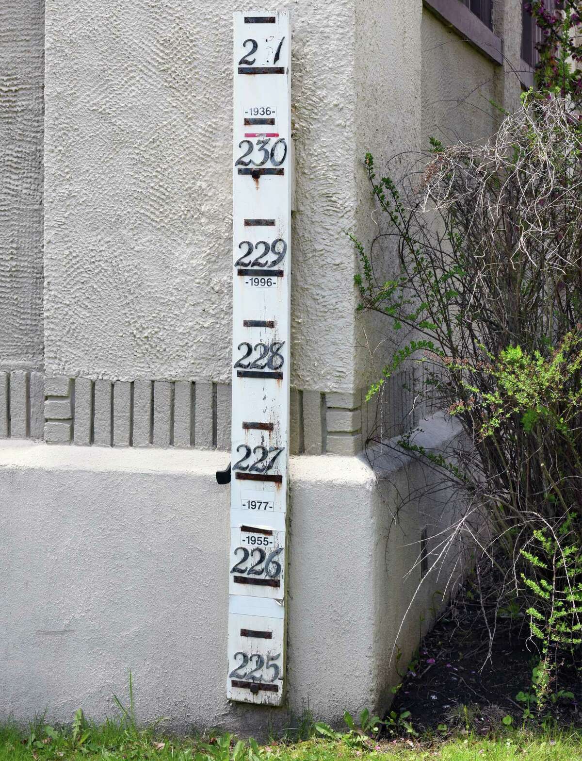 Water line marker outside the North Ferry Street pump station on the Mohawk River in the Stockade Wednesday May 3, 2017 in Schenectady, NY. Residents in the historic Stockade neighborhood fear a planned new pump station will obstruct views of the river. (John Carl D'Annibale / Times Union)