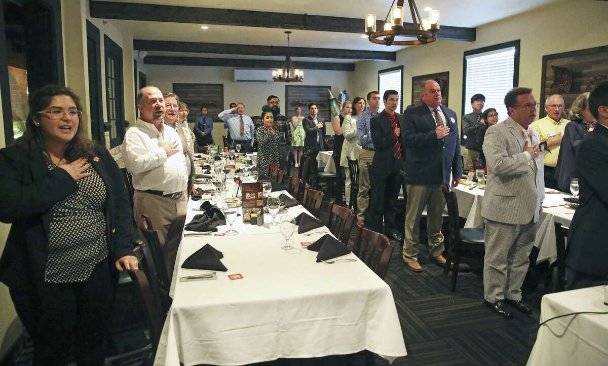 Elizabeth Amy Hernandez (left) leads the group in the Pledge of Allegiance as UIW College Republicans meet at Galpoa Gaucho Brazilian Steakhouse to celebrate their fromation on May 4, 2017.