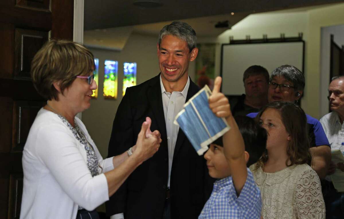 Ron Nirenberg listens as Rev. Diana Phillips, lead pastor at Colonial Hills United Methodist Church talks with his son Jayden,8, and niece Jayden,10 on Sunday, May 7, 2017.