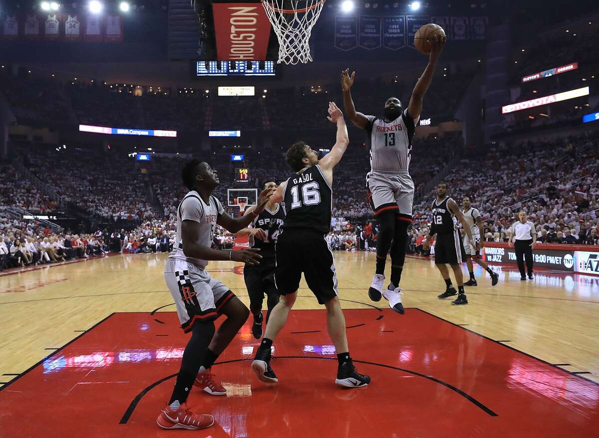 HOUSTON, TX - MAY 07: James Harden #13 of the Houston Rockets attacks the basket against Pau Gasol #16 of the San Antonio Spurs during Game Three of the NBA Western Conference Semi-Finals at Toyota Center on May 7, 2017 in Houston, Texas. NOTE TO USER: User expressly acknowledges and agrees that, by downloading and or using this photograph, User is consenting to the terms and conditions of the Getty Images License Agreement. (Photo by Ronald Martinez/Getty Images)