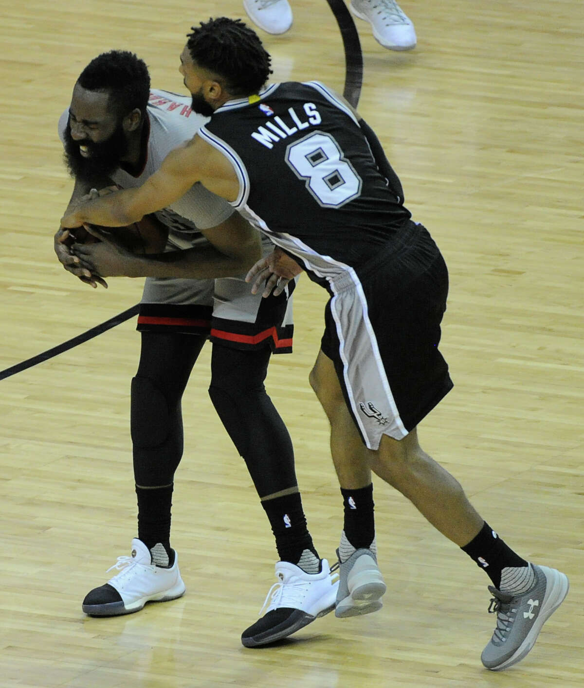 Houston Rockets guard James Harden (13) battles with San Antonio Spurs guard Patty Mills (8) during the second half of the NBA Western Conference semifinals Game 4 Sunday, May 7, 2017, in Houston. ( Yi-Chin Lee / Houston Chronicle )
