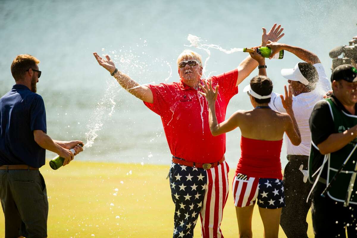THE WOODLANDS, TX - MAY 07: John Daly of the United States is sprayed with champagne at the eighteenth green following his victory at the PGA TOUR Champions Insperity Invitational at The Woodlands Country Club on May 7, 2017 in The Woodlands, Texas. (Photo by Darren Carroll/Getty Images)
