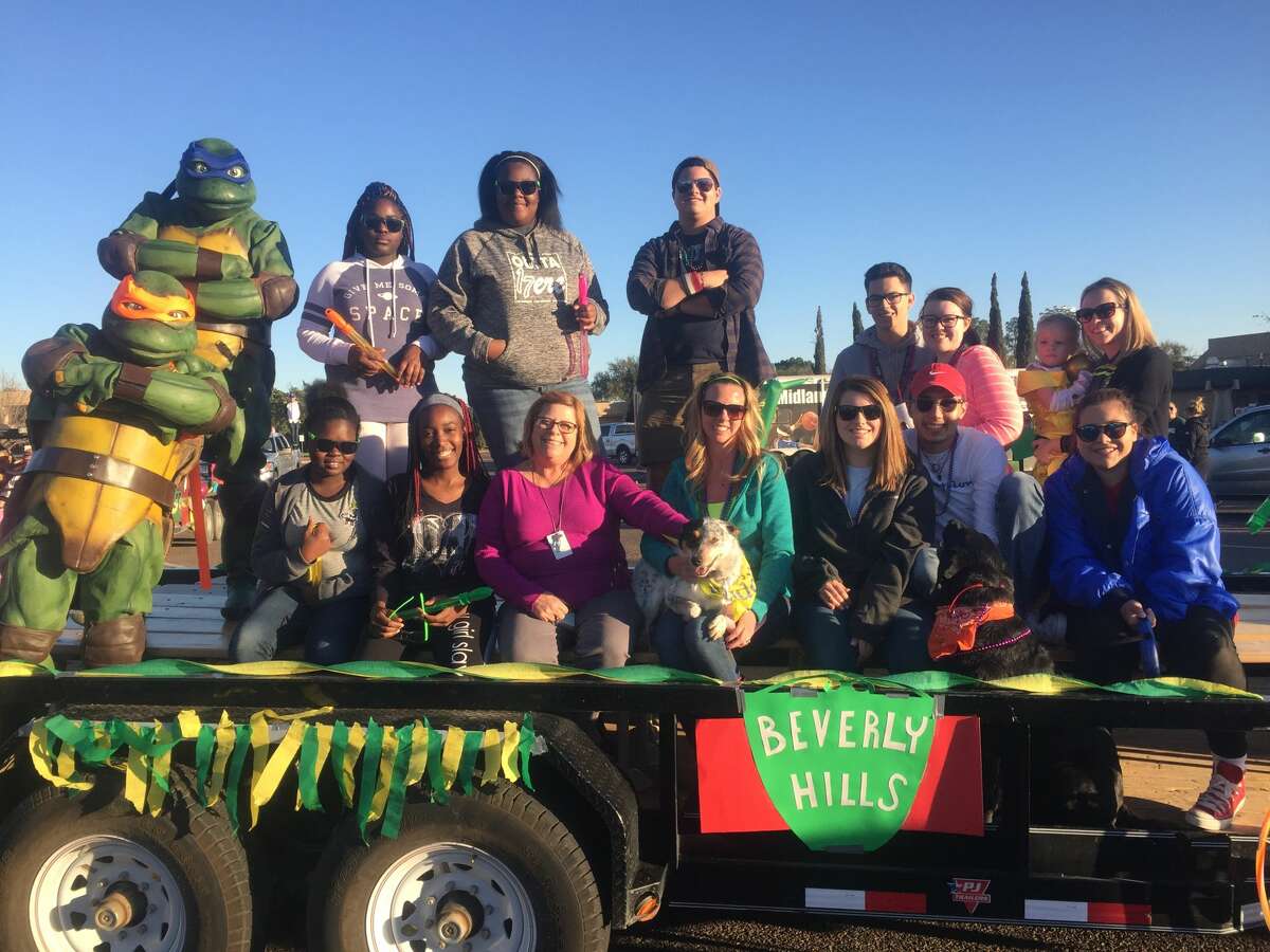 Homecoming: Tofunmi Korobake, bottom row from left, Lilian Simiyu, Jan Sliger, Chelsea Burch, Sarah Hobbs, Samuel Robledo and Rebecca McAdoo; Murielle Mbopda, top row from left, Isis Howell, Alex Corrales, Alex Chick, Cameron Baker and Wendy Gilbert (holding Nola)