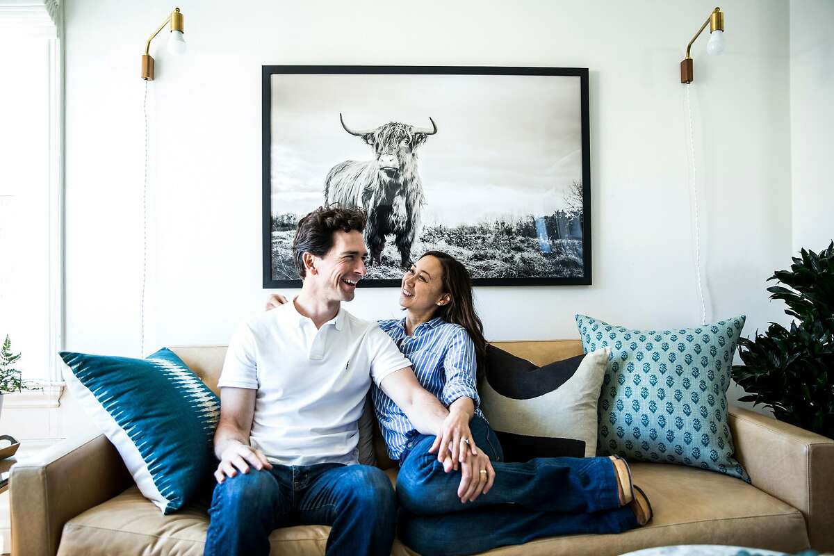 Homeowners Christine Everett and husband Tony Righetti pose for a portrait in the living room of their newly remodeled home in San Francisco, Calif. on Friday, May 5, 2017.