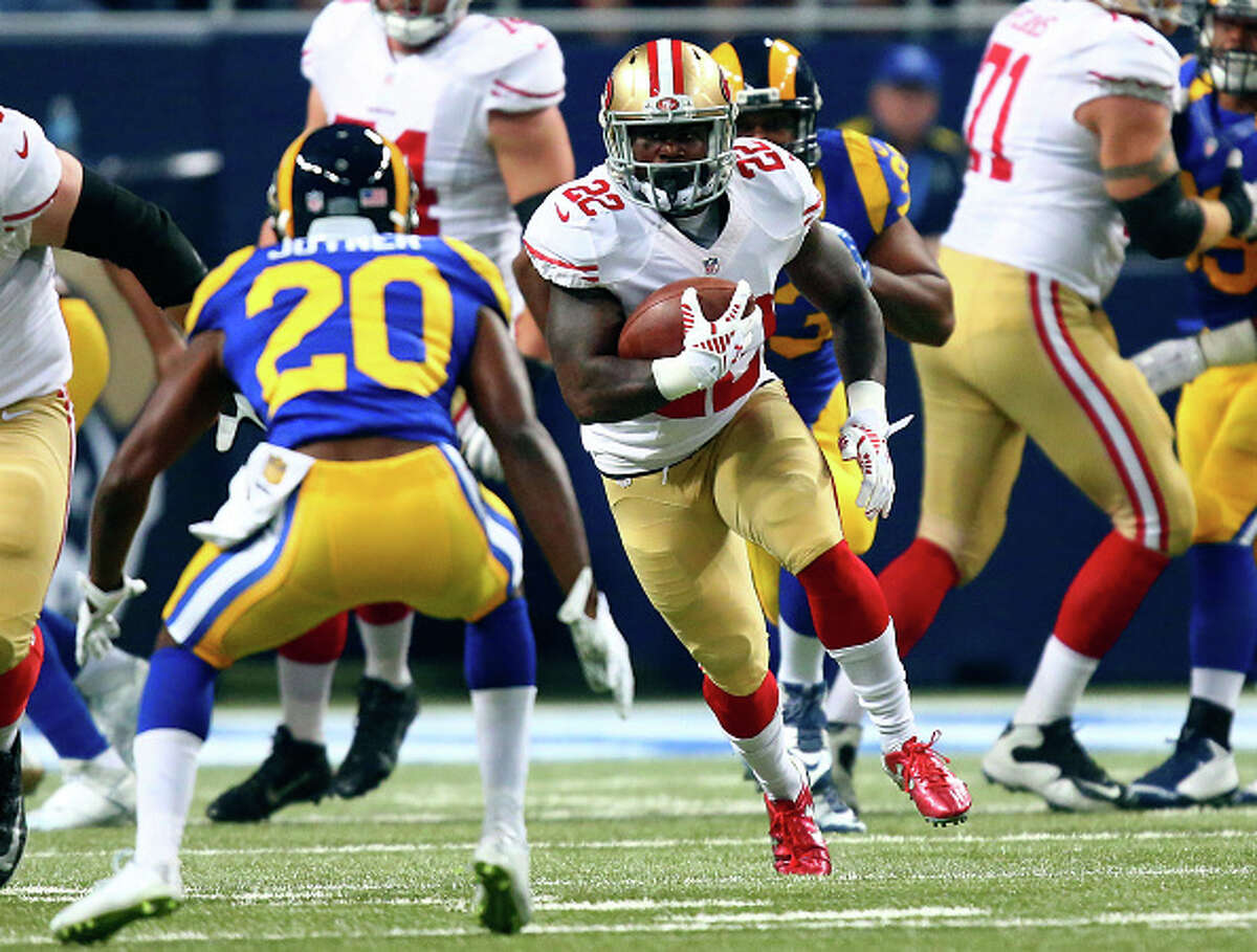 ST. LOUIS, MO - NOVEMBER 1: Mike Davis #22 of the San Francisco 49ers runs the ball as Lamarcus Joyner #20 of the St. Louis Rams defends in the first quarter at the Edward Jones Dome on November 1, 2015 in St. Louis, Missouri. (Photo by Dilip Vishwanat/Getty Images)