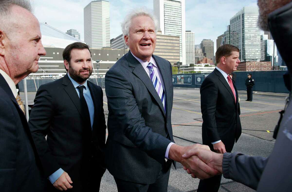 General Electric CEO Jeff Immelt, center, greets construction workers following a ceremonial groundbreaking on the site of GE's new headquarters, Monday, May 8, 2017, in Boston. (AP Photo/Michael Dwyer) ORG XMIT: MAMD101