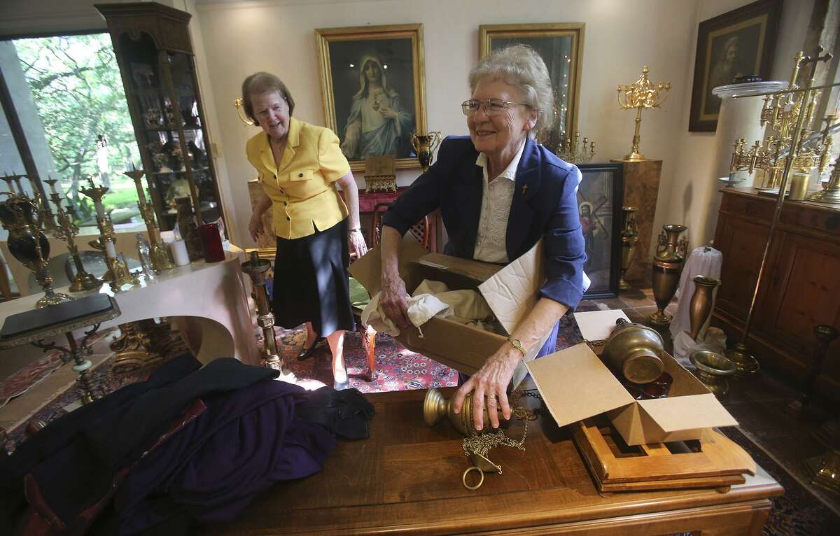 Sister Deborah Fuchs (left) and sister Gloria Ann Fiedler (right) unpack items that will be sold at a special event sale to be held May 11, 2017 at the Estate Sale Gallery at Los Patios at 2015 NE Loop 410. The items on sale will be marked with tags and is not an auction or estate sale, but rather a special event sale of religious objects from Our Lady of the Lake's convent. Items such as paintings, altar candelabrum, and crucifixes will be on sale.