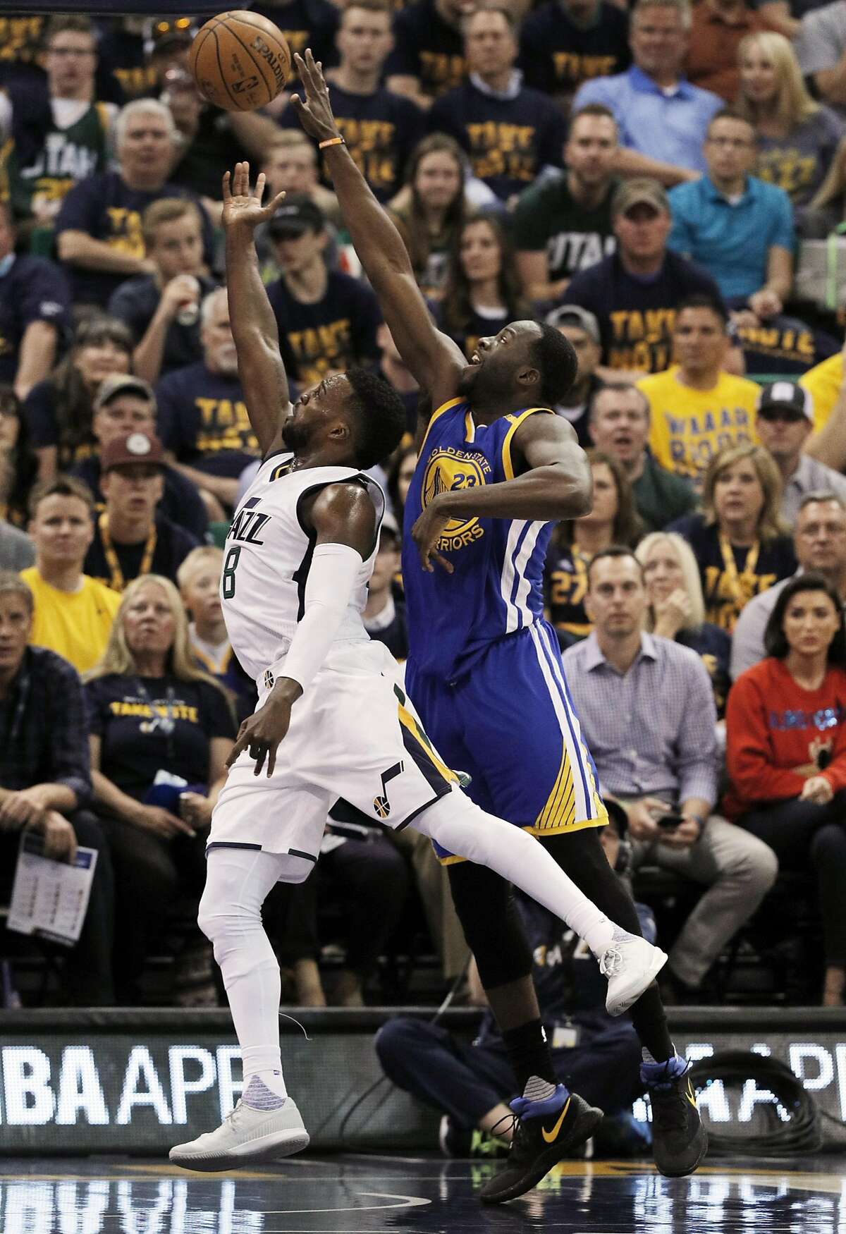 Draymond Green (23) defends against Shelvin Mack (8) in the first half as the Golden State Warriors played the Utah Jazz at Vivint Smart Home Arena in Salt Lake City, Utah, on Monday, May 8, 2017, in Game 4 of the 2017 Western Conference Semifinals. The