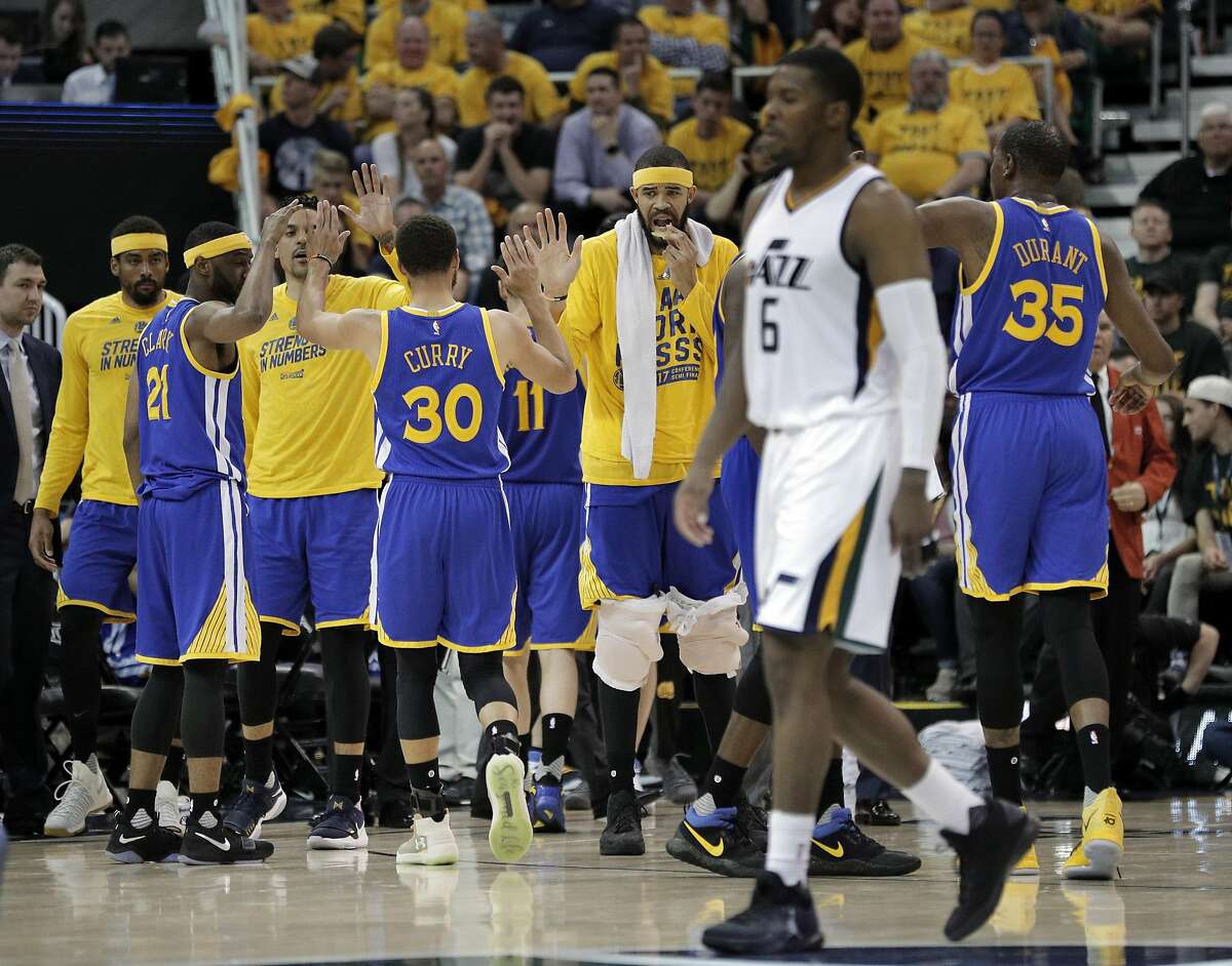 The Warriors bench rises up to high five players coming in for a timeout in the second half as the Golden State Warriors played the Utah Jazz at Vivint Smart Home Arena in Salt Lake City, Utah, on Monday, May 8, 2017, in Game 4 of the 2017 Western Conference Semifinals. The Warriors defeated the Jazz 121-95 to sweep the series and advance to the Western Conference Finals