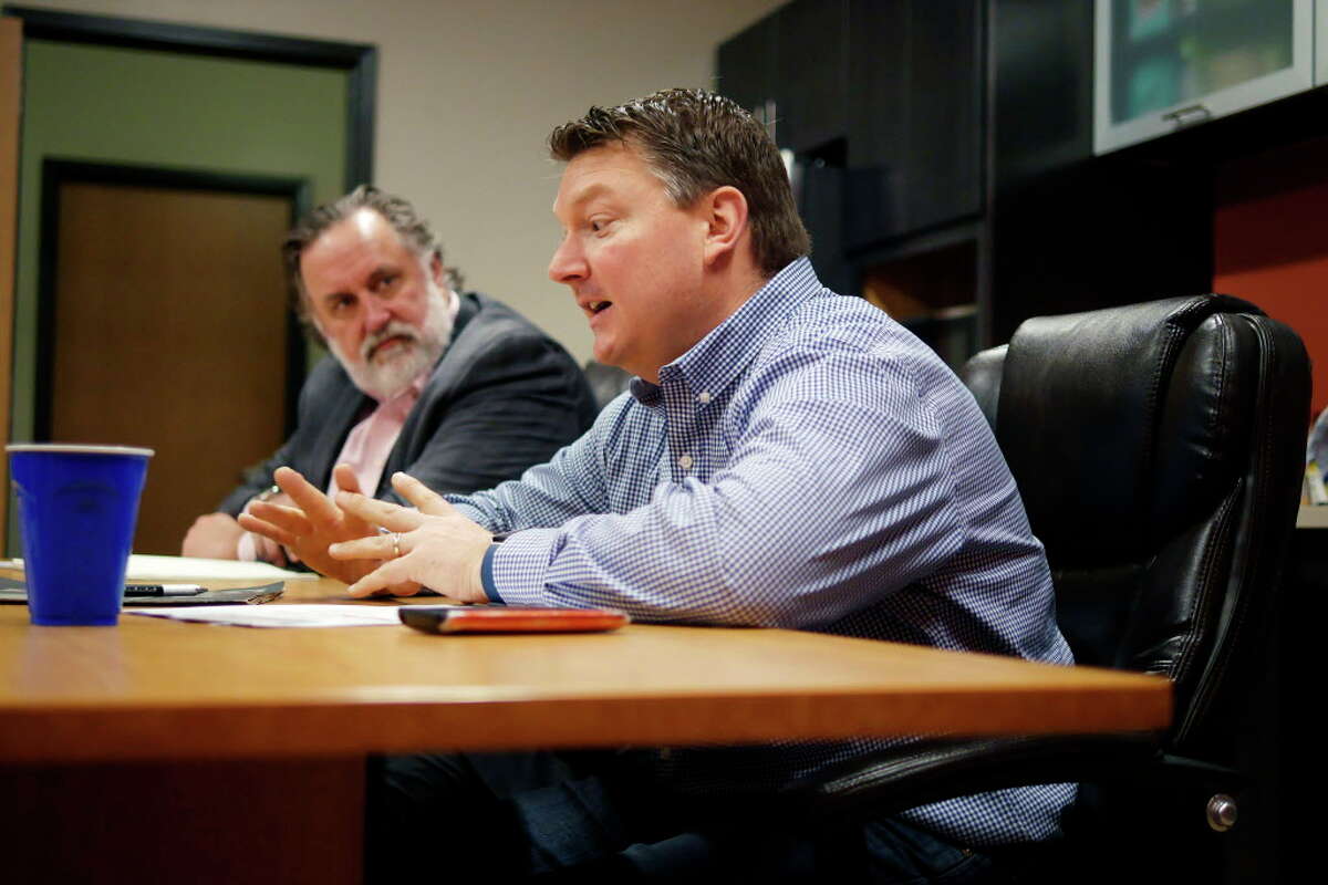 Marty Vanags, left, president of Saratoga County Prosperity Partnership, looks on as William Lindheimer, general manager for Land Remediation, Inc., talks about his company's work on Thursday, April 6, 2017, in Waterford, N.Y. (Paul Buckowski / Times Union)