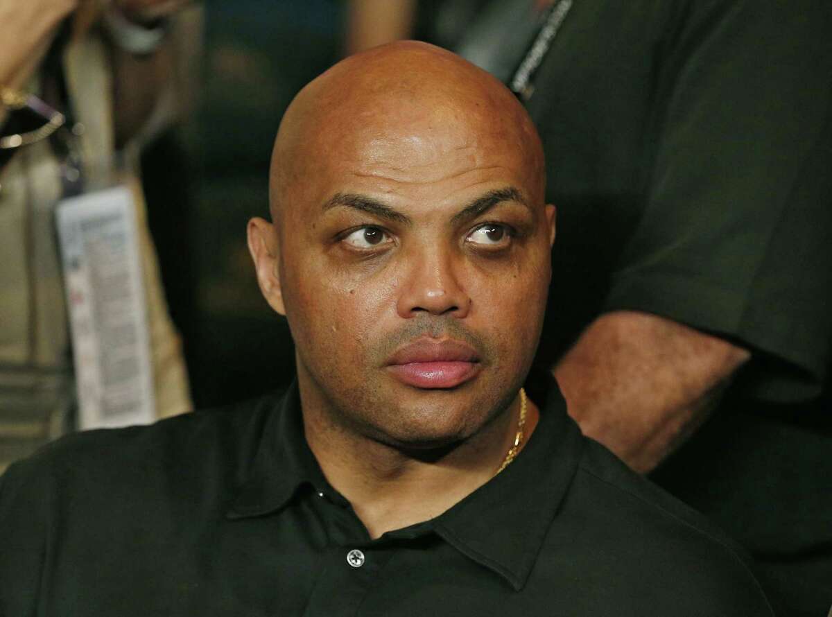 FILE - In this May 2, 2015, file photo, Charles Barkley joins the crowd before the start of the world welterweight championship bout between Floyd Mayweather Jr., and Manny Pacquiao in Las Vegas. After LeBron James was criticized by Barkley for questioning ClevelandÂ?’s front office, James tore into the former NBA star and opinionated TV commentator on Monday, Jan. 30, following a loss in Dallas. (AP Photo/John Locher, File)