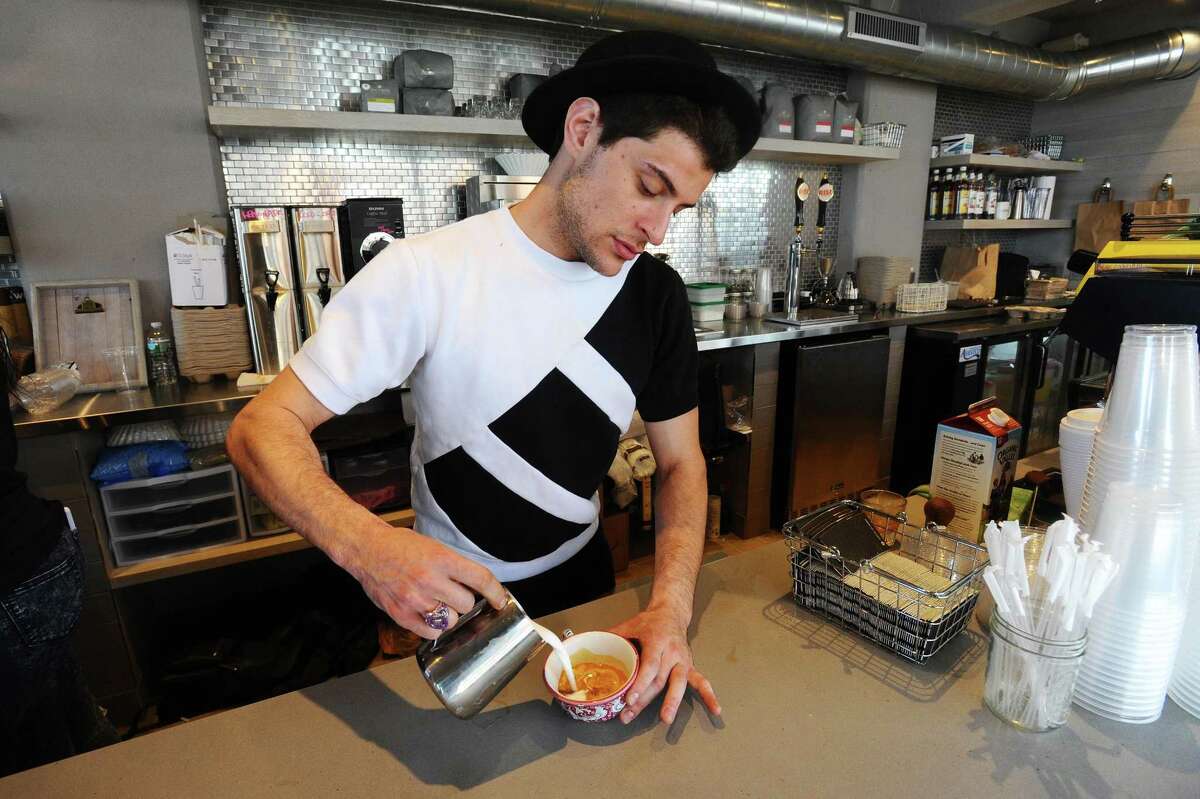 Stuart Schmerzler makes a latte inside the newly opened Granola Bar located at 700 Canal St. in Stamford, Conn. on Tuesday, May 9, 2017.