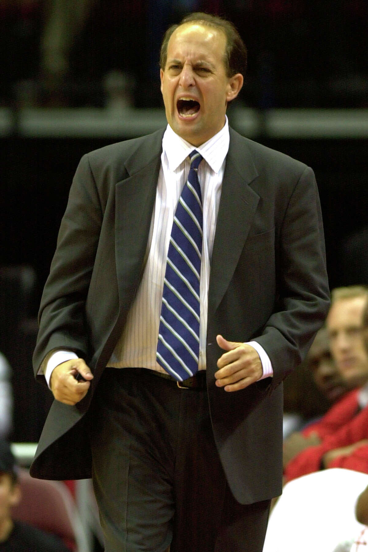 Houston Rockets coach Jeff Van Gundy yells during the fourth quarter against the Denver Nuggets, Thursday, Oct. 30, 2003, in Houston. Van Gundy won his first game as the Rockets head coach with a 102-85 win over the Nuggets. (AP Photo/Brett Coomer)