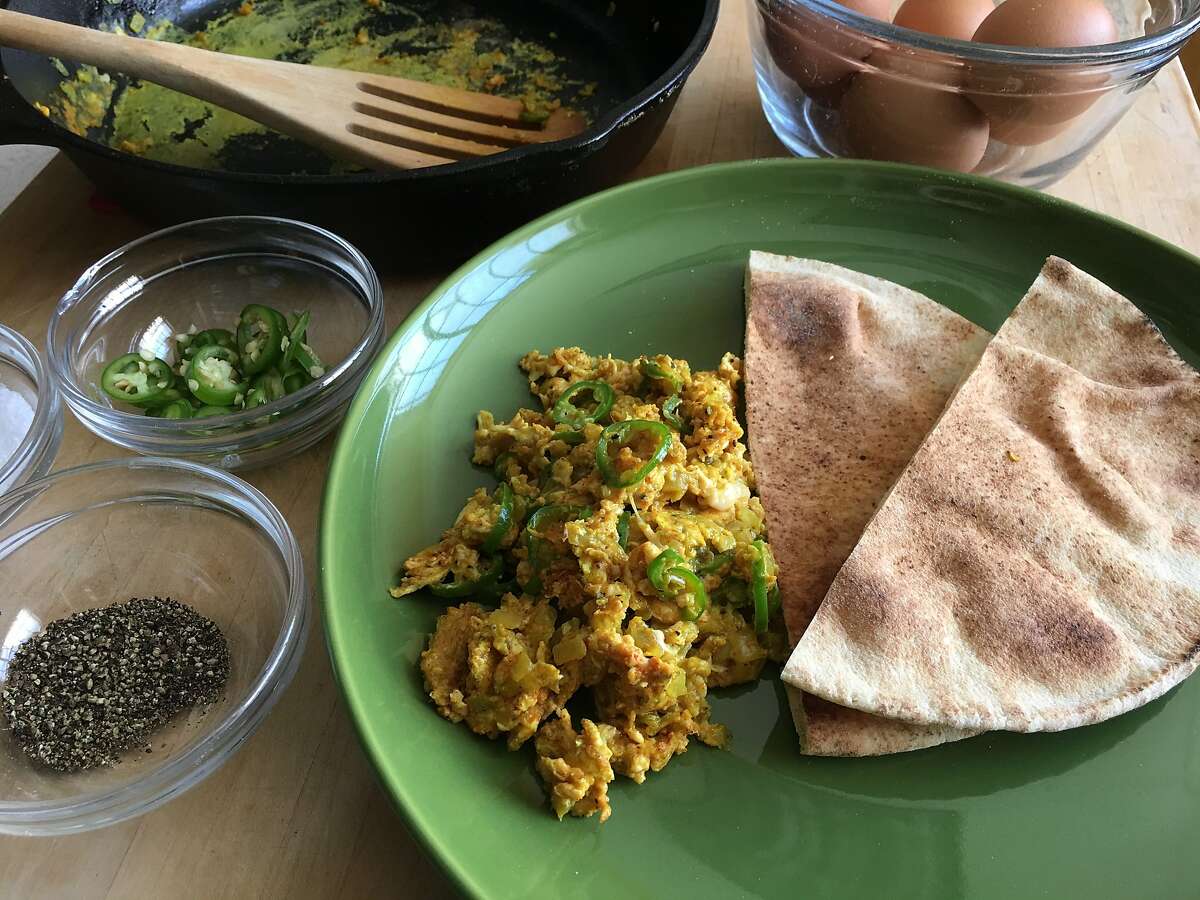 Omar's Mom's Churr Anda, eggs scrambled with onion, serrano chiles and turmeric and served with toasted pita bread