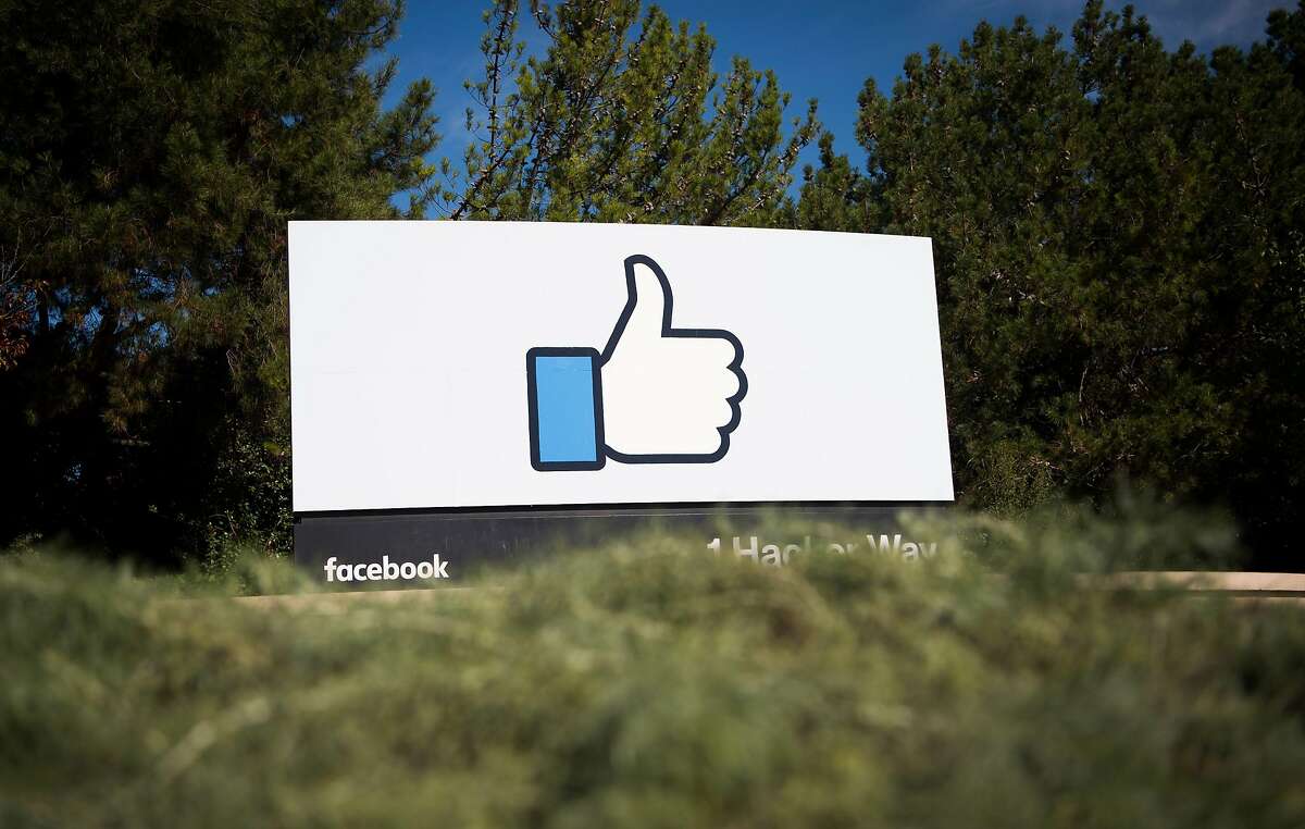 (FILES) This file photo taken on November 4, 2016 shows the Facebook sign and logo in Menlo Park, California. Facebook said on May 3, 2017, it would add 3,000 people to screen out violent content as the social media giant faces scrutiny for a series of killings and suicides broadcast on its platform. "If we're going to build a safe community, we need to respond quickly," chief executive Mark Zuckerberg said on his Facebook page. / AFP PHOTO / JOSH EDELSONJOSH EDELSON/AFP/Getty Images