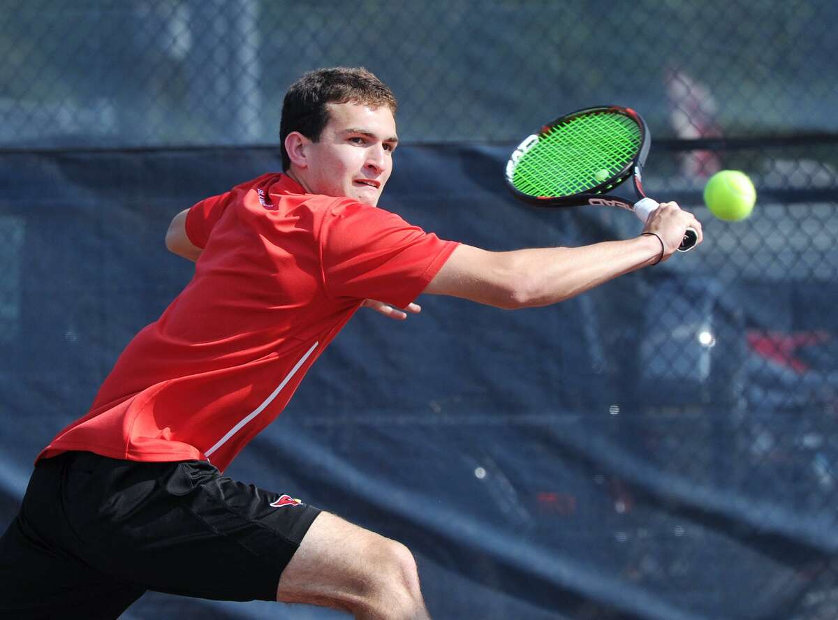 William Blumberg of Greenwich hits during the match he won against William Andrews of Staples during the FCIAC boys high school championship tennis match between Greenwich High School and Staples High School at Wilton High School, Conn., Wednesday, May 25, 2016. Staples beat Greenwich 4-3 to take the championship.