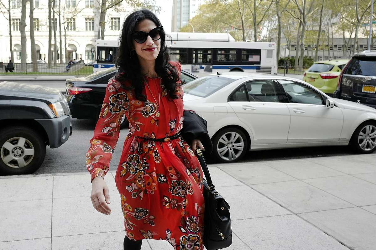 FILE - In this Nov. 2, 2016 file photo, Huma Abedin is seen in the Brooklyn borough of New York. A person familiar with the investigation into Hillary Clinton's use of a private email server says Abedin did not forward "hundreds and thousands" of emails to her husband's laptop, as FBI Director James Comey testified to Congress. (AP Photo/Mark Lennihan, File)
