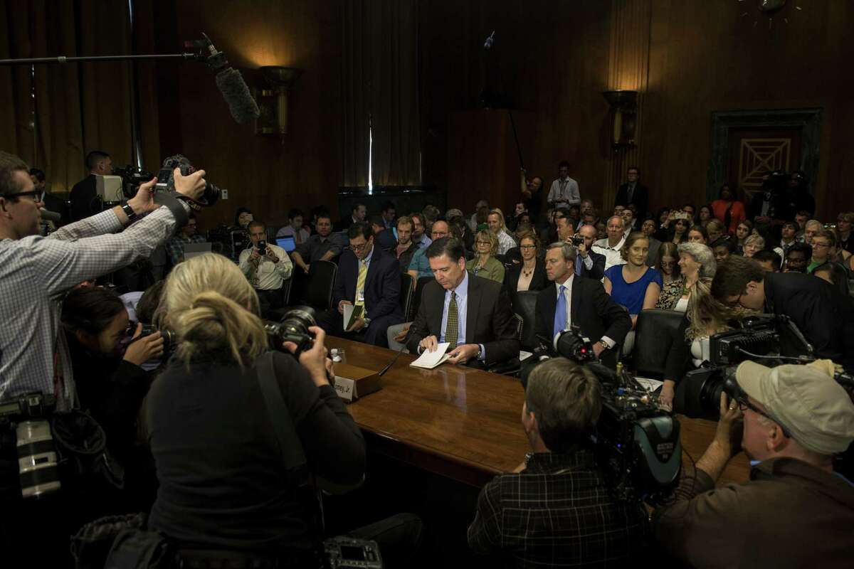 FILE-- FBI Director James Comey prepares to testify before Senate Judiciary Committee on Capitol Hill, in Washington, May 3, 2017. Politicians, analysts and journalists are still debating whether a letter from Comey sent to Congress on Oct. 28 about new evidence in the investigation into Hillary Clinton?’s emails cost Clinton the presidency. It?’s certainly possible. But it?’s also unclear in part because of the final Upshot/Siena College poll in Florida conducted before the letter. (Gabriella Demczuk/The New York Times)