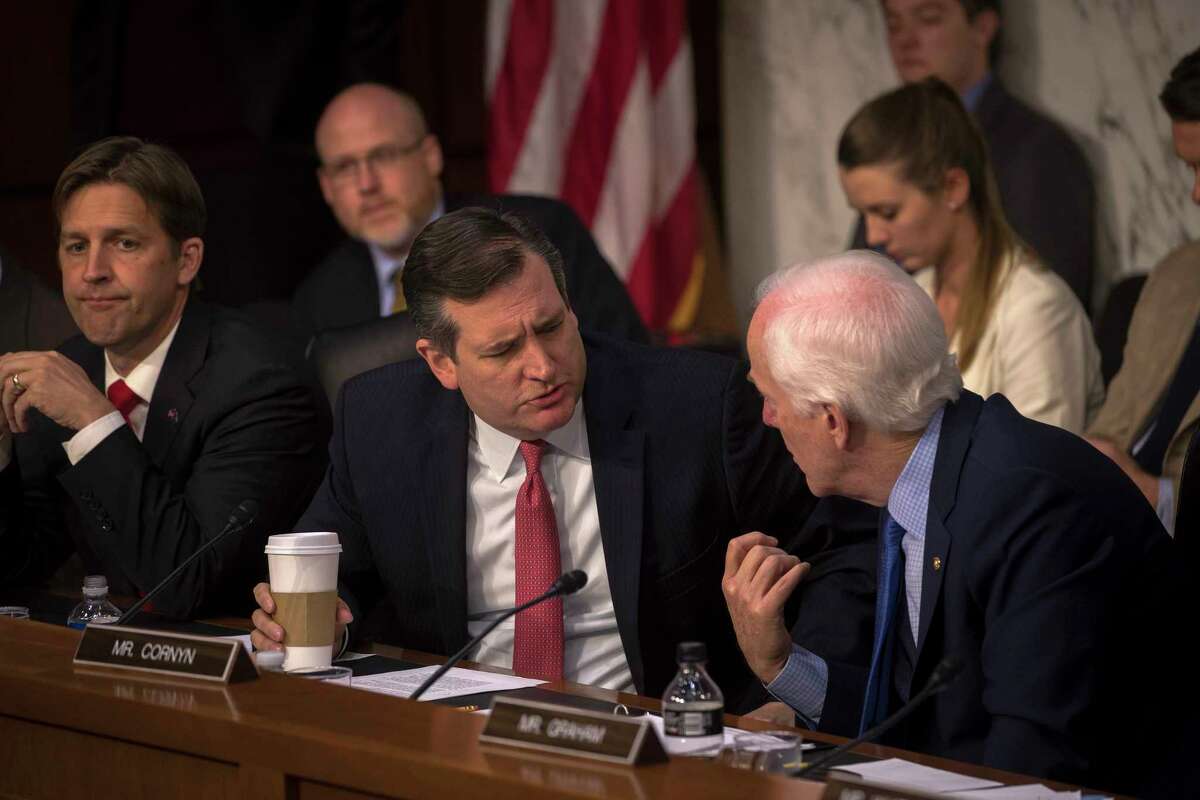 Texas Sens. Ted Cruz, left, and John Cornyn confer during a Senate Judiciary subcommittee hearing on Russia's alleged interference in last year's election, on Capitol Hill in Washington, May 8, 2017. Sally Yates, the former acting attorney general, and James Clapper, the former director of national intelligence, appeared before the committee. (Stephen Crowley/The New York Times)