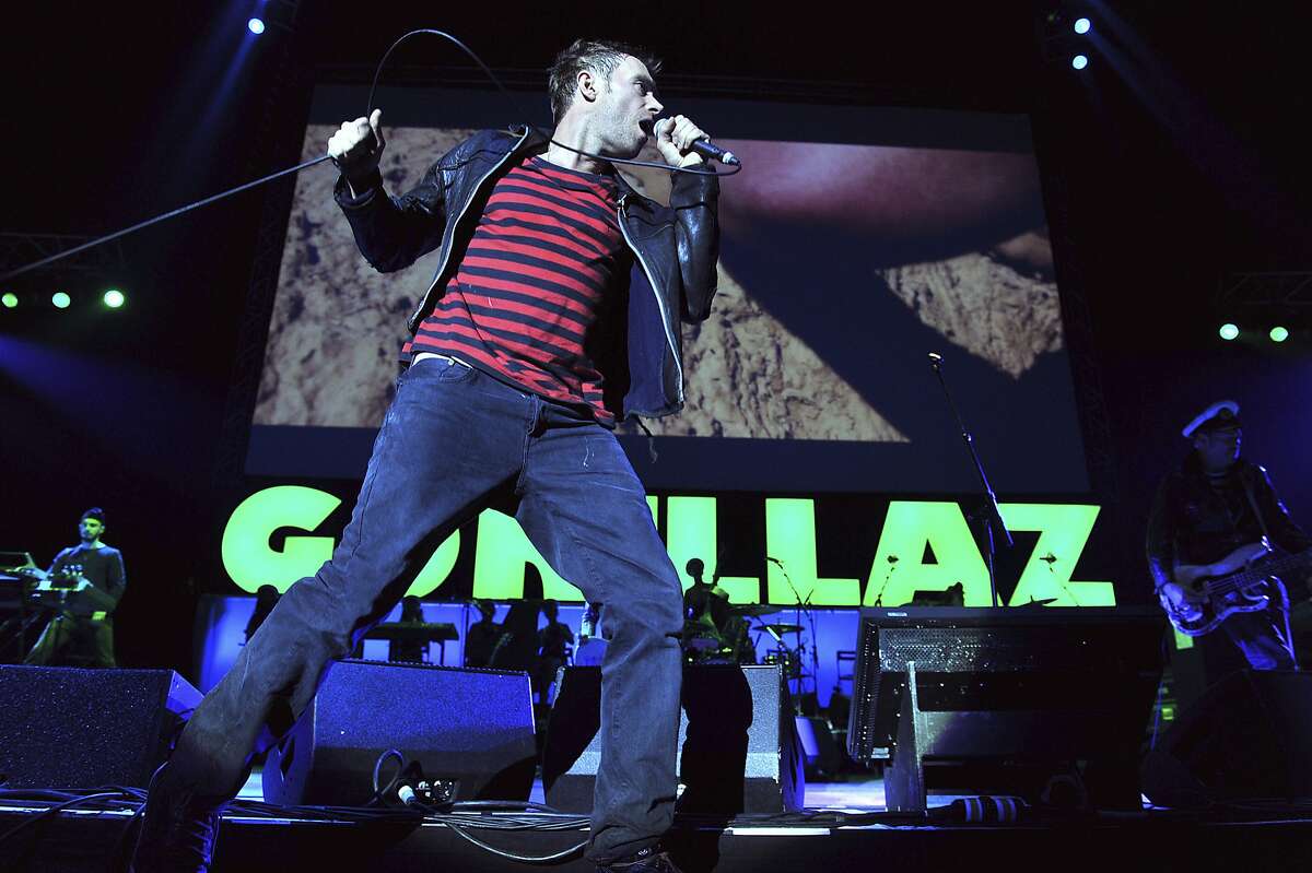 FILE - In this Nov. 14, 2010, file photo, the British band Gorillaz performs at London's O2 Arena. The band is one of many musicians using new technology, including 360-degree cameras, virtual reality musical experiences and vertical videos, to reach the smart phone generation of music fans who are discovering new music on their phones and tablets. (AP Photo/Mark Allan, File)